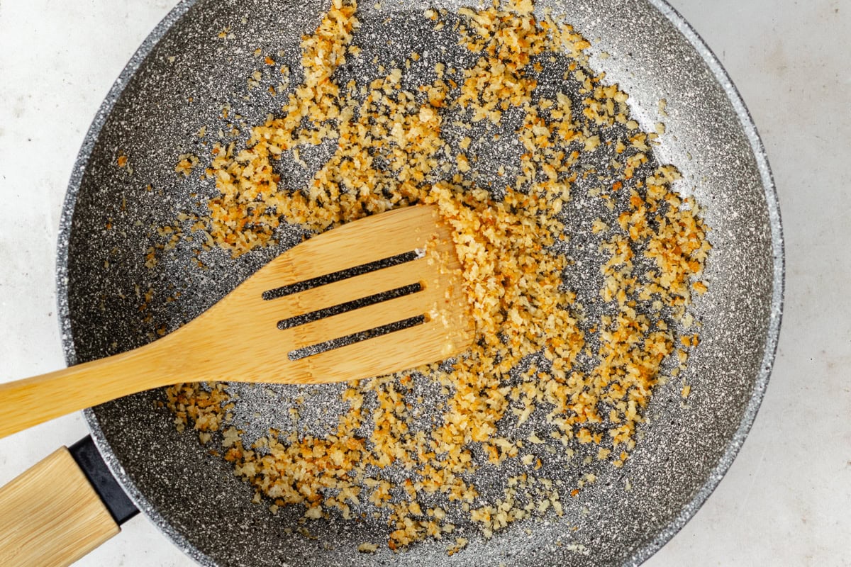 panko breadcrumbs toasting in skillet. 