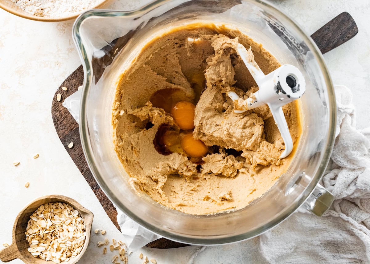 iced oatmeal cookies being mixed in mixing bowl. 