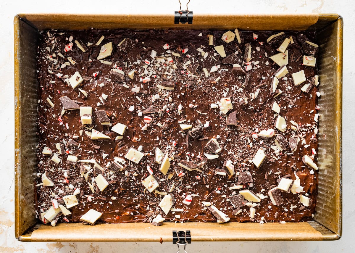 peppermint bark brownie batter spread into pan ready to be baked. 