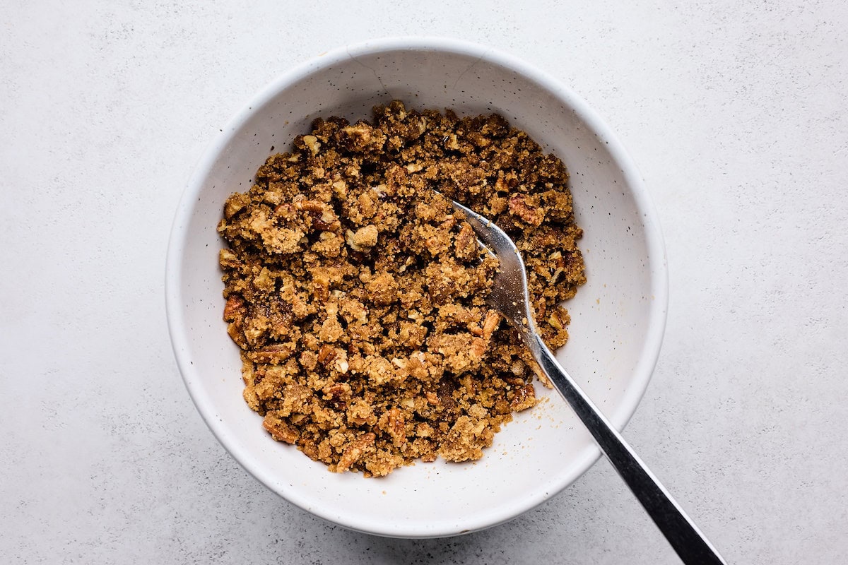 brown sugar pecan topping in bowl with fork. 