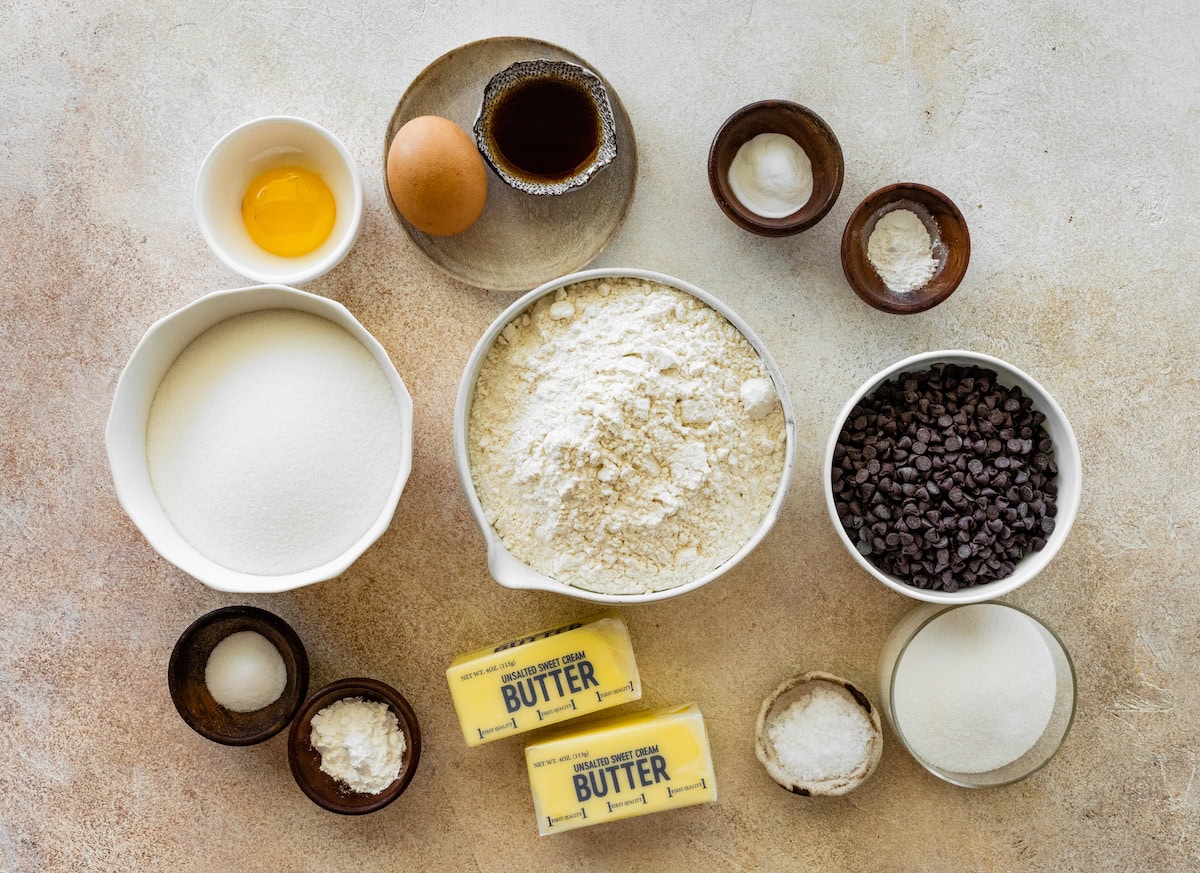 ingredients in bowls to make chocolate chip sugar cookies. 