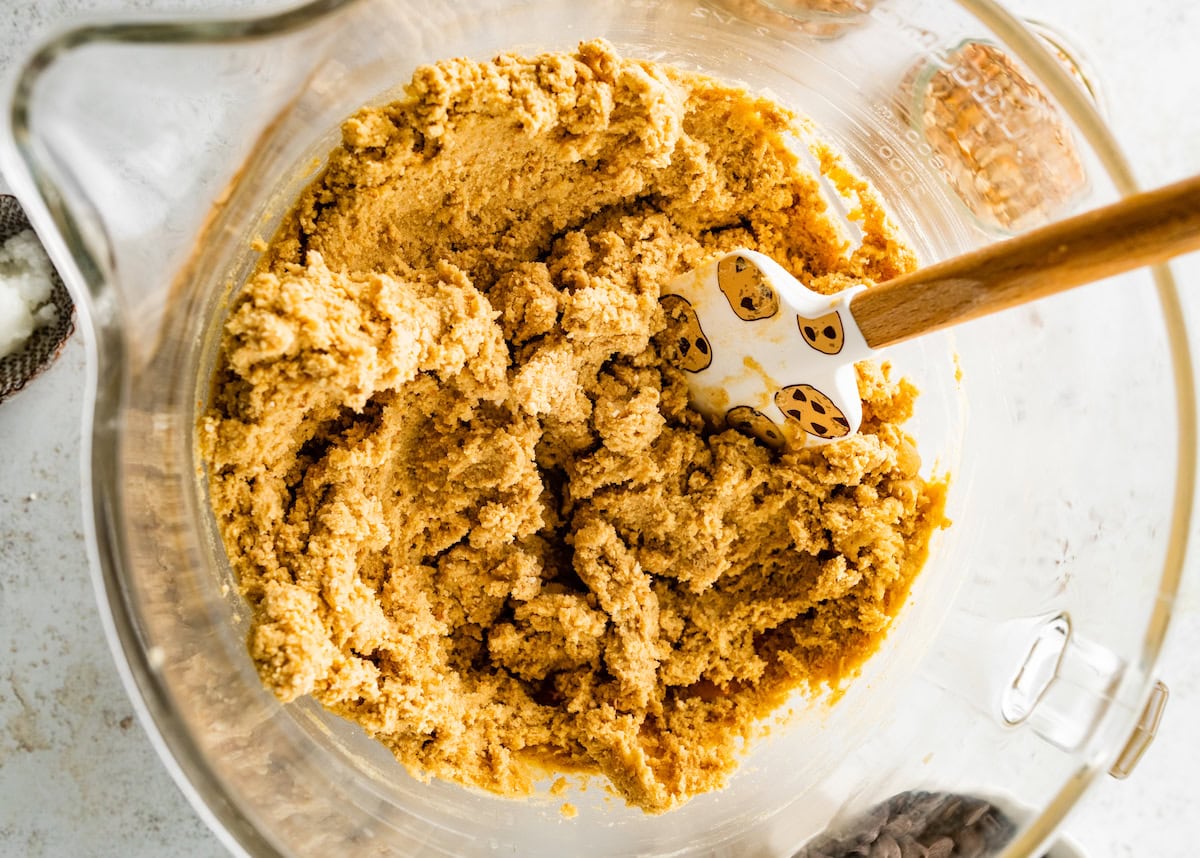 pretzel cookie dough in mixing bowl with spatula. 