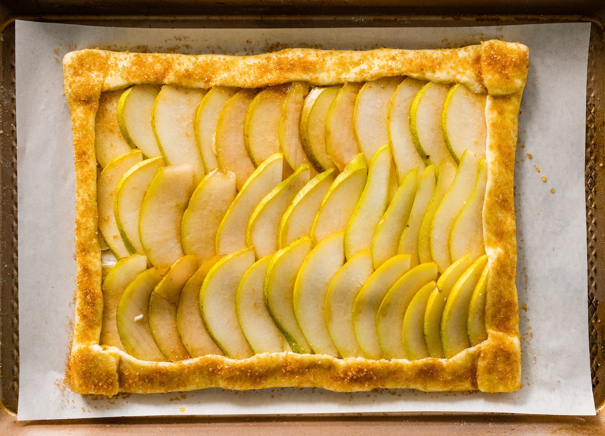 pear slices arranged on puff pastry sheet and sprinkled with turbinado sugar. 