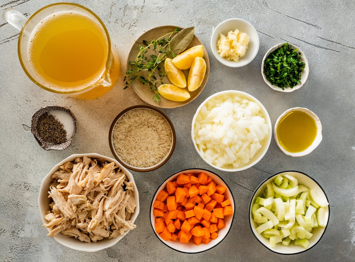 ingredients in bowls to make chicken and rice soup. 