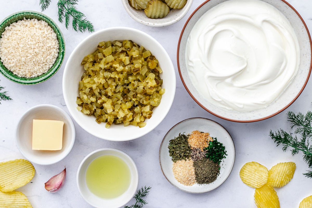 ingredients in bowls to make dill pickle dip. 