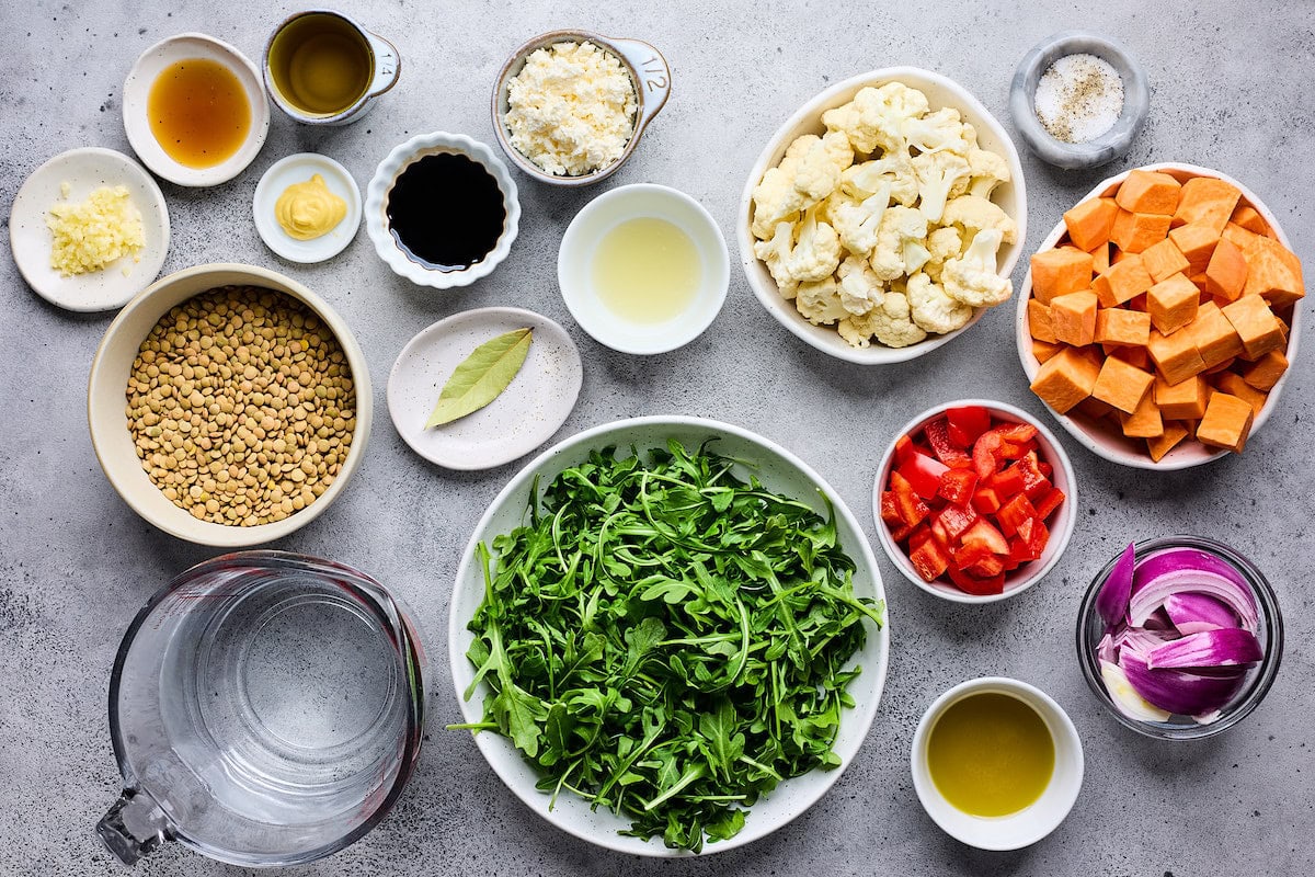 ingredients in bowls to make roasted vegetable lentil salad. 