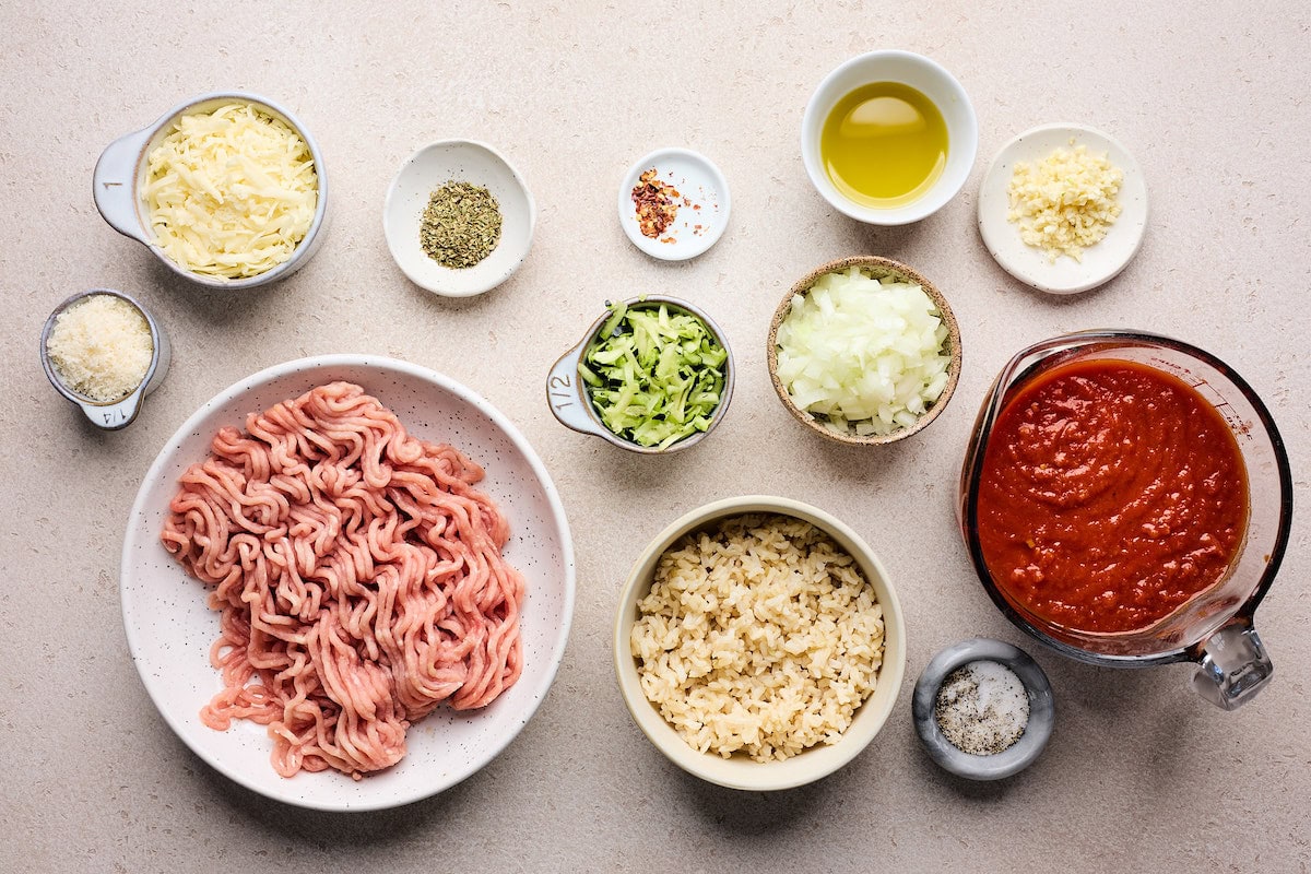 ingredients in bowls to make Cheesy Ground Turkey Rice Skillet with Marinara Sauce.