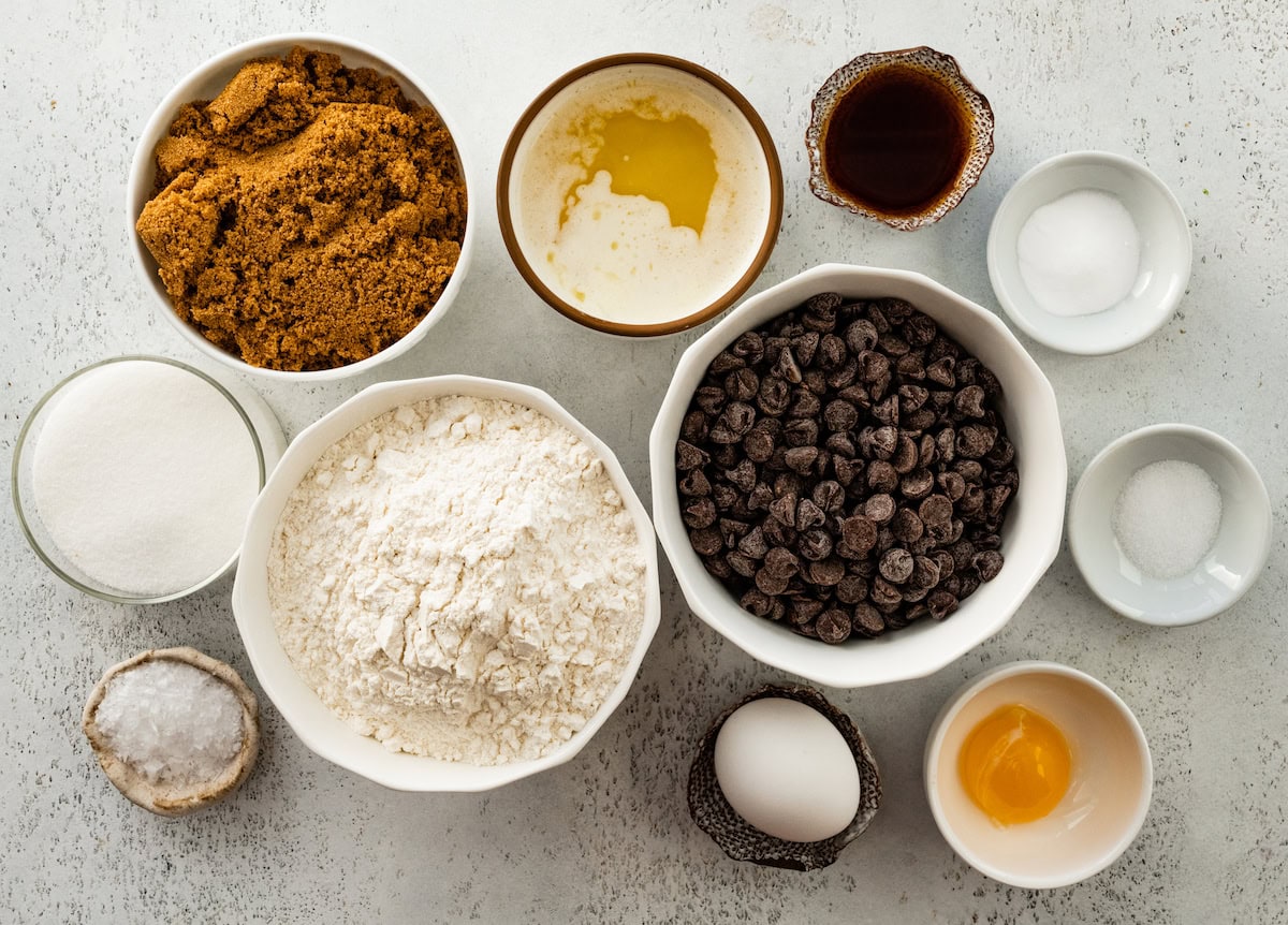 ingredients in bowls to make chocolate chip cookie bars. 