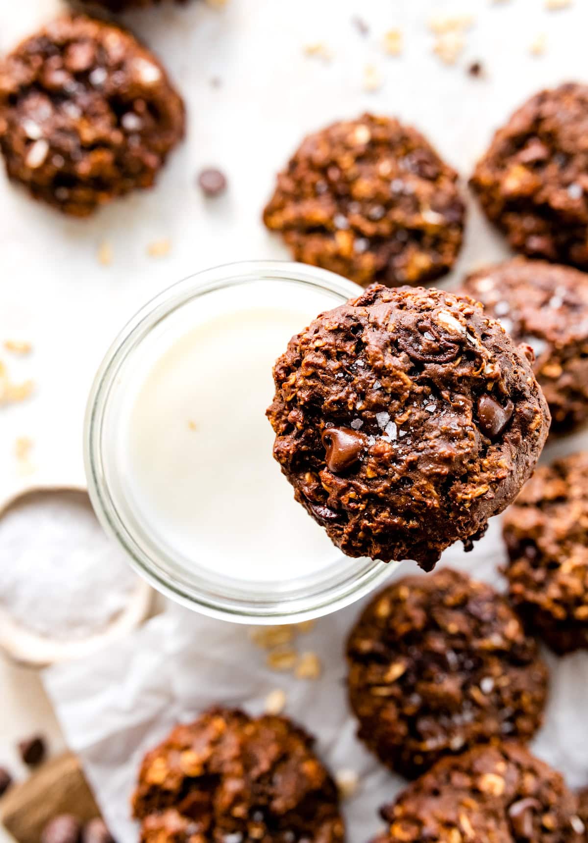 healthy chocolate cookie on glass of milk. 