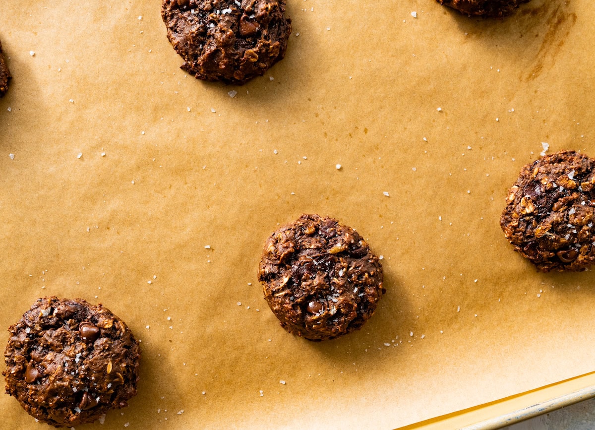 healthy chocolate cookies on baking sheet with parchment paper. 