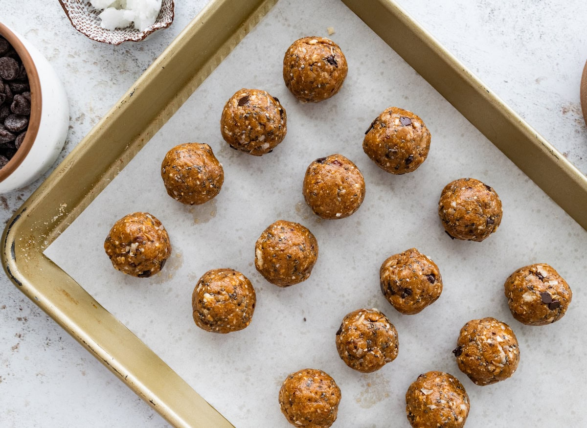 samoa cookie protein balls on baking sheet with parchment paper. 