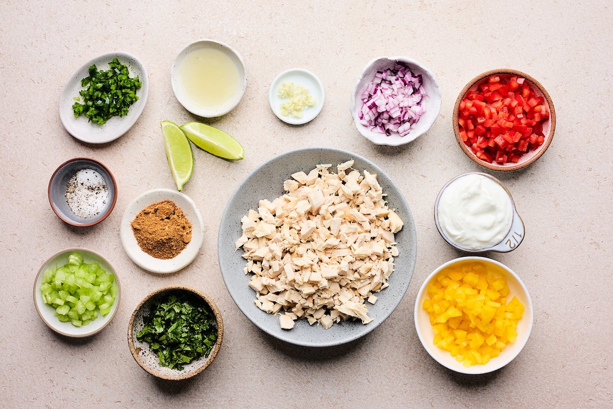 ingredients in bowls to make taco chicken salad. 