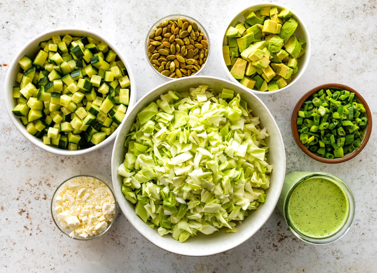 green goddess salad ingredients in bowls. 