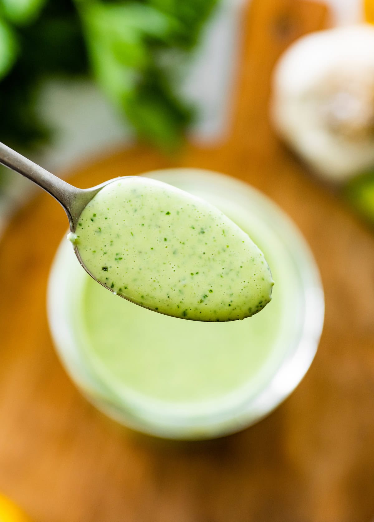 green goddess dressing on spoon. 